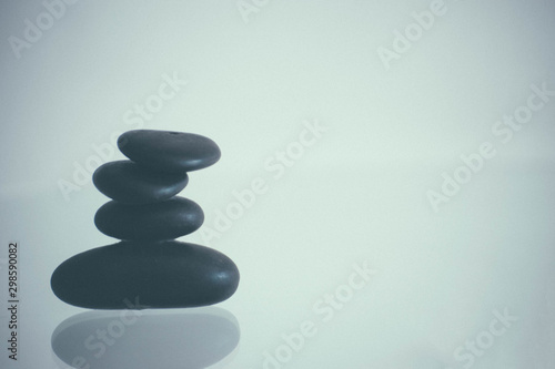spa scene with balanced stones on a background that reflects peace and tranquility