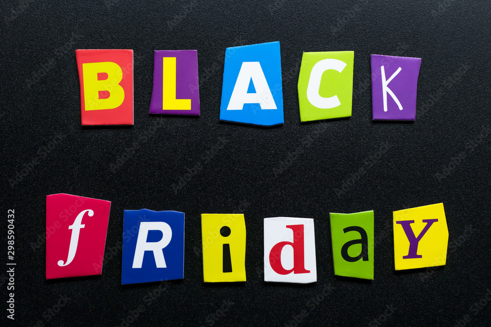 Text - Black Friday - on dark background. Cut colorful letters from newspapers. Shopping, sale concept. Card with an inscription. Headline, caption on banner. Text - Black Friday - on dark background. Cut colorful letters from newspapers. Shopping, sale concept. Card with an inscription. Headline, caption on banner.