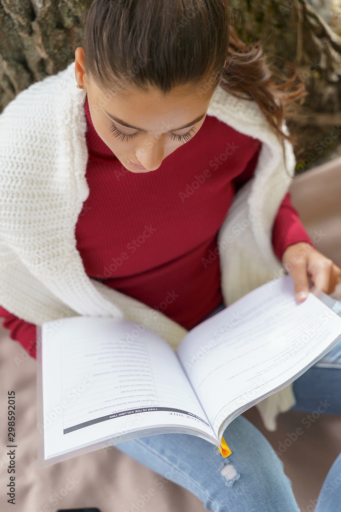 Serious student preparing for her future exams Serious student preparing for her future exams