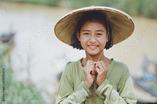 Fototapete Portrait of Asian Beautiful Burmese girl farmer in Myanmar