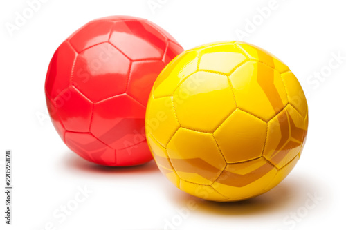 yellow and red football balls  isolated on white background
