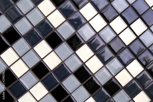 Mosaic Background of Black, White And Gray Ceramic Tiles.