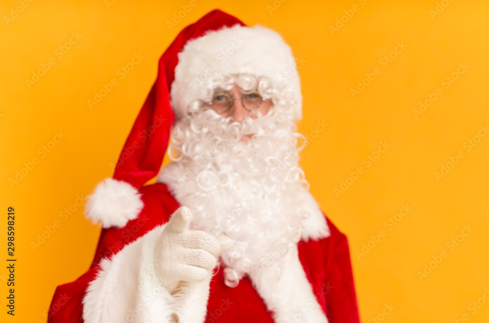 Handsome Santa Claus pointing finger at camera Handsome Santa Claus pointing finger at camera