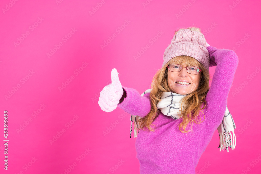 adult woman with warm clothes isolated on color background adult woman with warm clothes isolated on color background