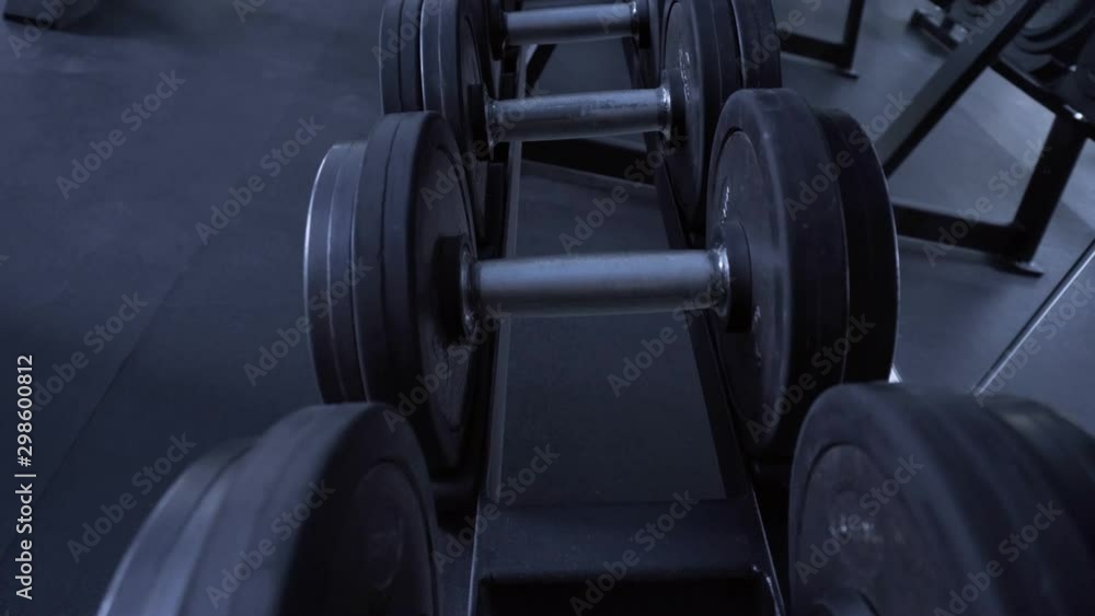 Inventory in the gym. Dumbbell and kettlebell close-up. Empty gym Inventory in the gym. Dumbbell and kettlebell close-up. Empty gym