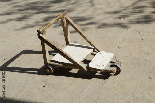 Homemade scooter made from wooden battens, plywood and bearings