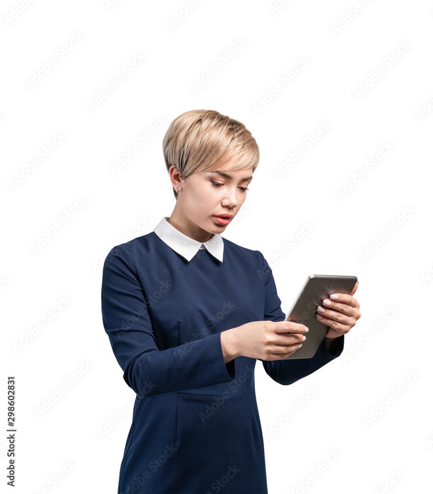 Serious young businesswoman with tablet, isolated Serious young businesswoman with tablet, isolated