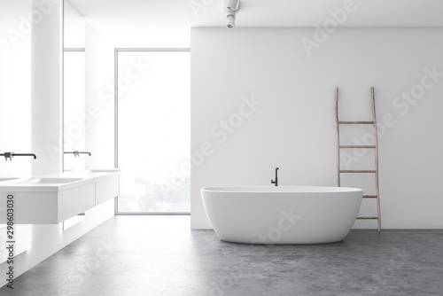 Modern white bathroom with tub and double sink