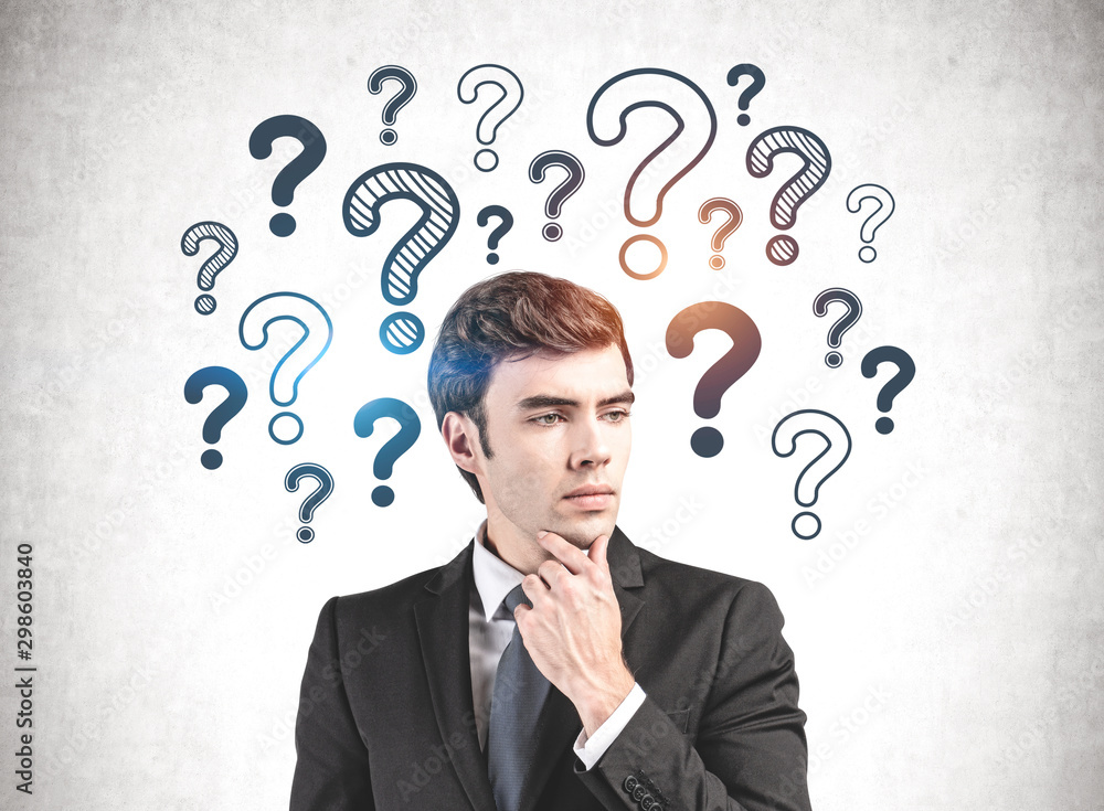 Thoughtful businessman with many questions Thoughtful businessman with many questions
