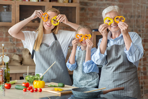 Cheerful family spending good time together while cooking