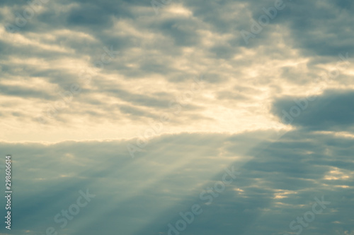 Sunlight shines through the cloudy sky. stormy sky with sunbeam