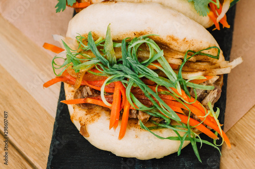 Hirata buns close-up. Known as Gua bao or bao buns, are a famous taiwanese food filled with pork photo