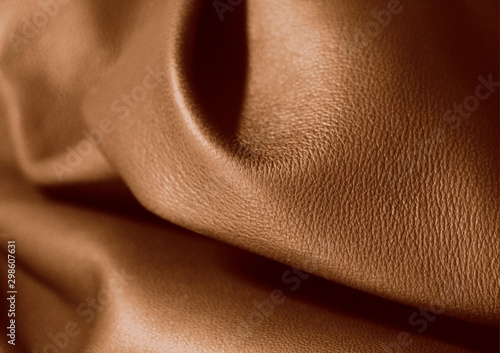 Natural leather texture. Chocolate colored leather. Brown background. Coffee shade of material.