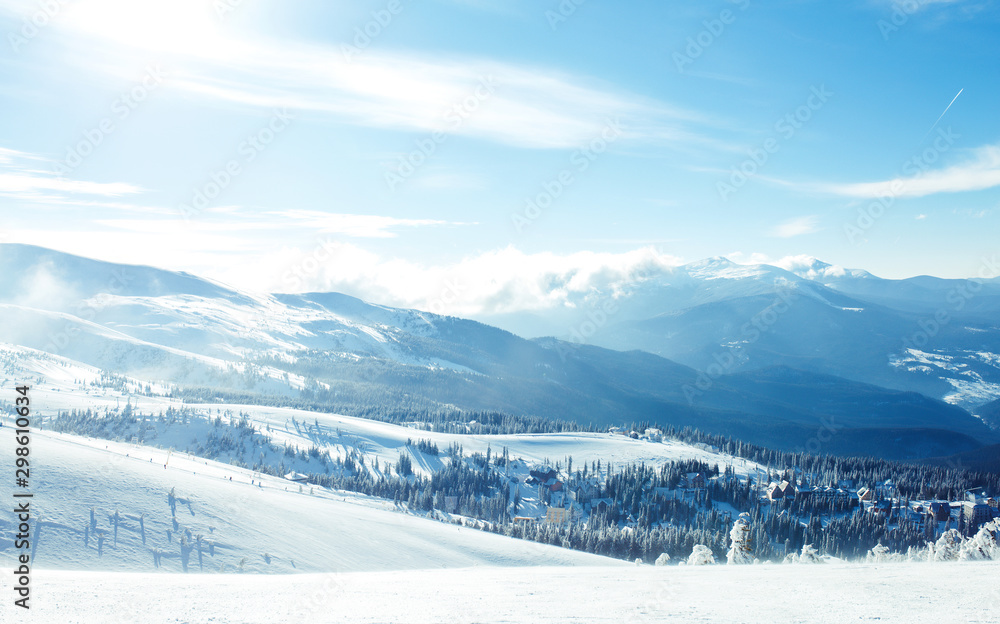 Nature. Beautiful winter landscape with snow covered trees. Beautiful view of the mountains from a high point. Concept of travel, freedom, beauty of nature. Beautiful day, sunny weather, blue sky.