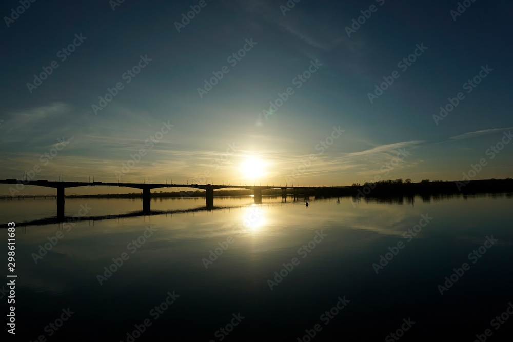 Long bridge over a wide river in the morning