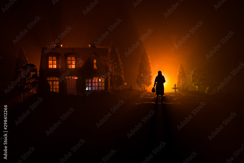 Fototapeta premium Diffuse entities walking on a street from an old European cemetery in moonlit night