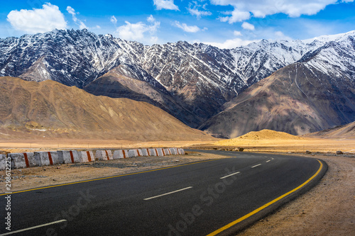 Photography Landscape view during a road trip with snow mountains on the background in Ladak