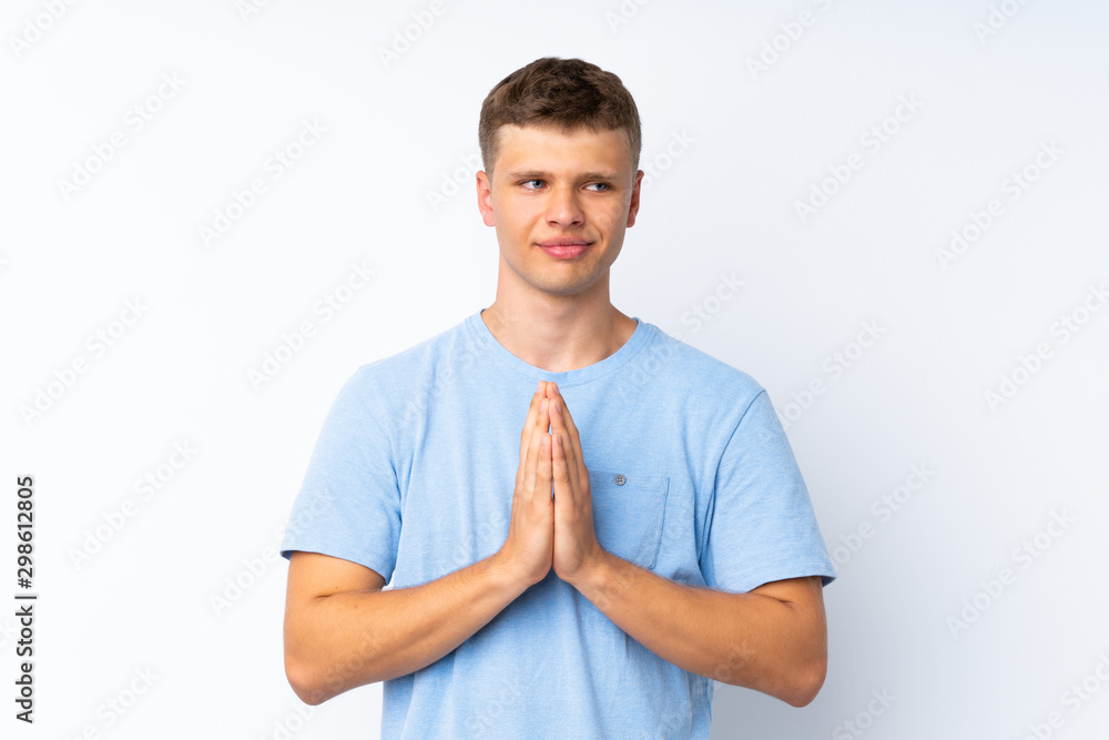 Young handsome man over isolated white background scheming something Young handsome man over isolated white background scheming something