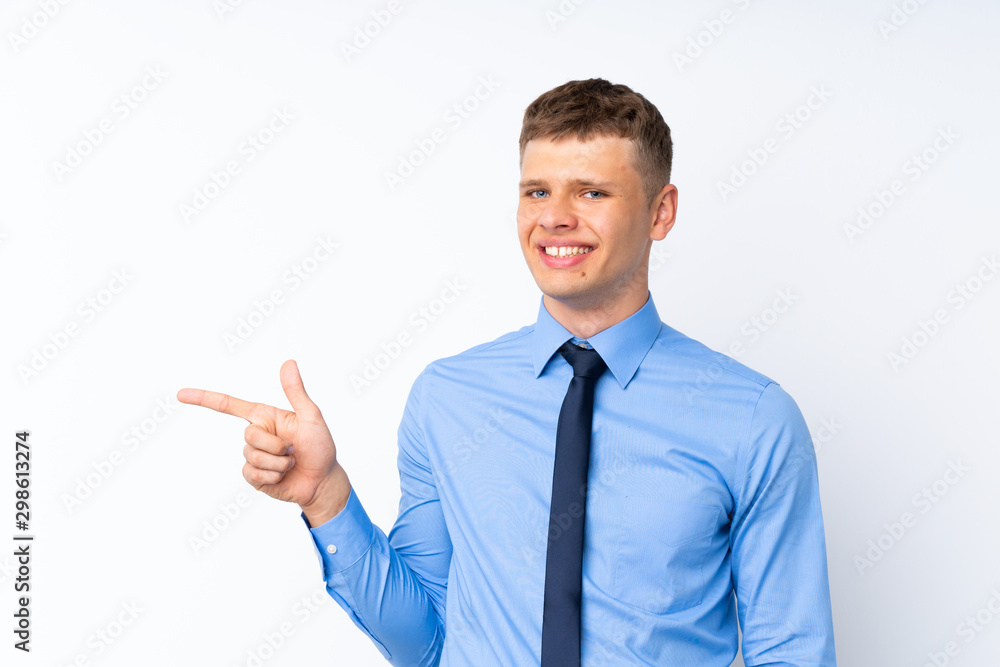 Young handsome businessman pointing finger to the side Young handsome businessman pointing finger to the side