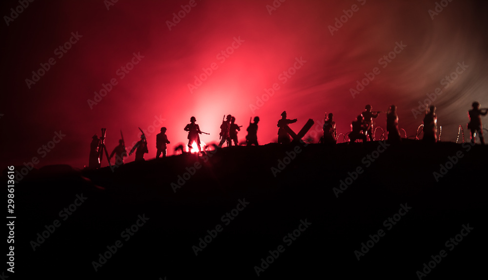 War Concept. Military silhouettes fighting scene on war fog sky background, World War German Tanks Silhouettes Below Cloudy Skyline At night. Attack scene. Armored vehicles and infantry.
