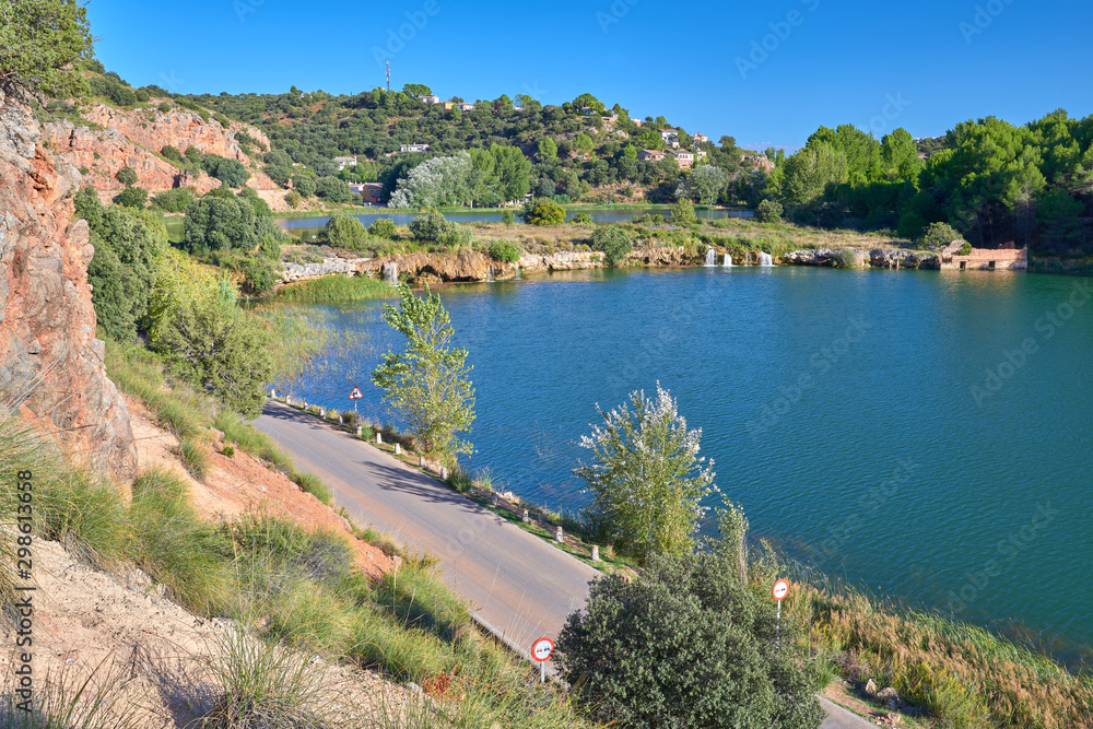 Landscape view of the waterfalls of the Laguna La Lengua Lake in the Lagunas de Ruidera Lakes Natural Park, Albacete province, Castilla la Mancha, Spain