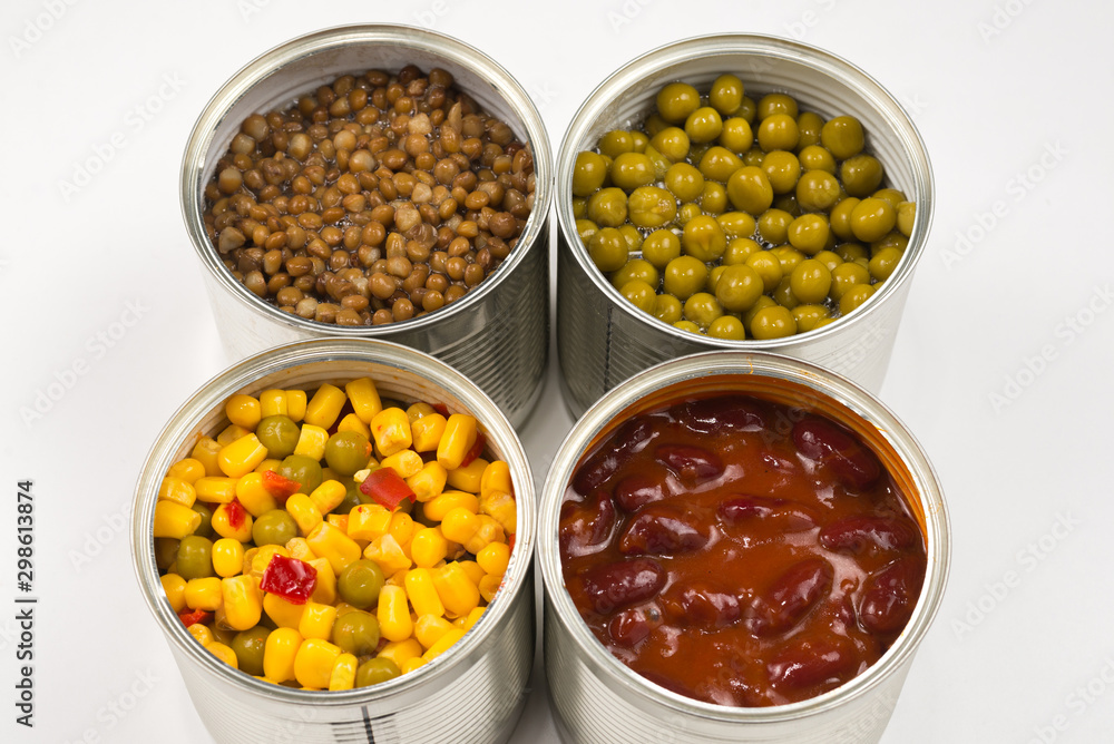 Canned food on white background. Green pea, beans, corn, lentils. Canned food on white background. Green pea, beans, corn, lentils.