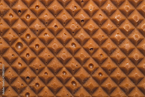 Chocolate bar macro texture. squared pattern background