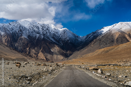 Landscape view during a road trip with snow mountains on the background on the way to Chang-la pass in Ladakh, Jammu and Kashmir, North India