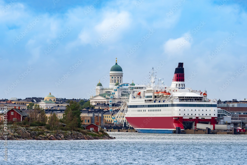 Finland. Helsinki. St. Nicholas Cathedral. Cruise liner at Helsinki pier. Loading containers on a ship. Ferris Wheel. Traveling by Ferry to Finland. Cruises on the European Union. Baltic Sea.