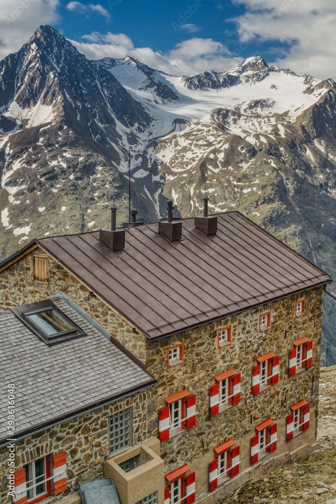 view of Breslauer Hütte, mountain chalet in the Austrian Alps, mountain lodge on the background of alpine peaks, base for climbing Wildspitze