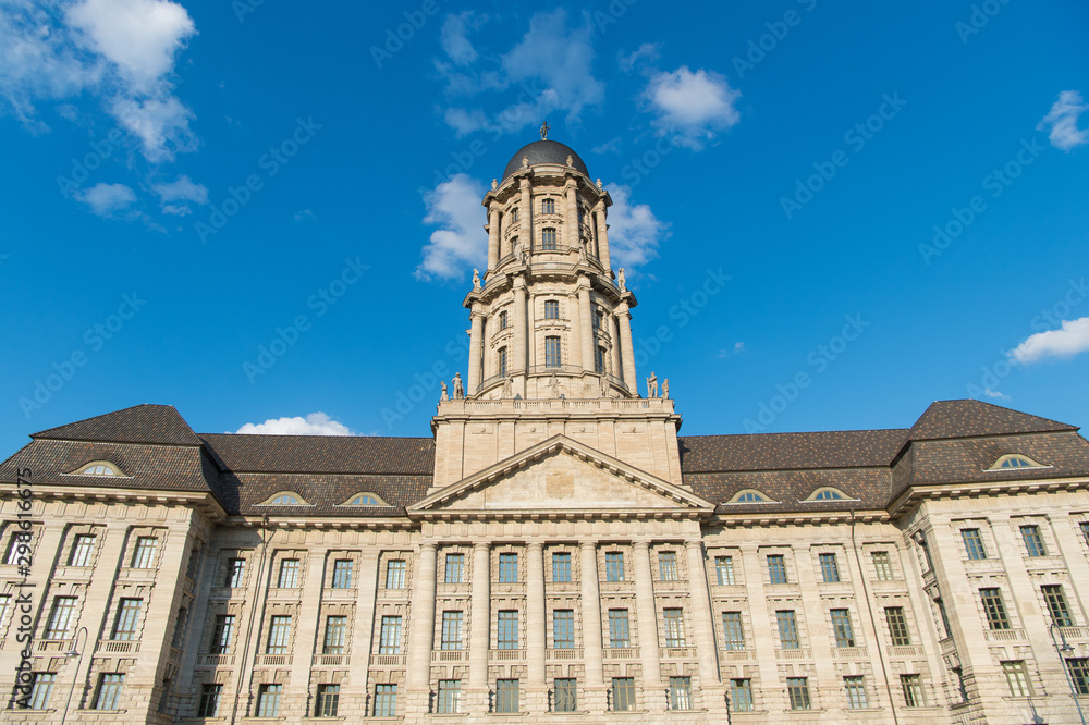 Building with dome or tower. Old city hall. Architecture and design. Building facade. Beautiful building on sunny day blue sky background. Building with columns classic style