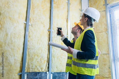 Canvas Print Construction manager and architect checking the insulation works