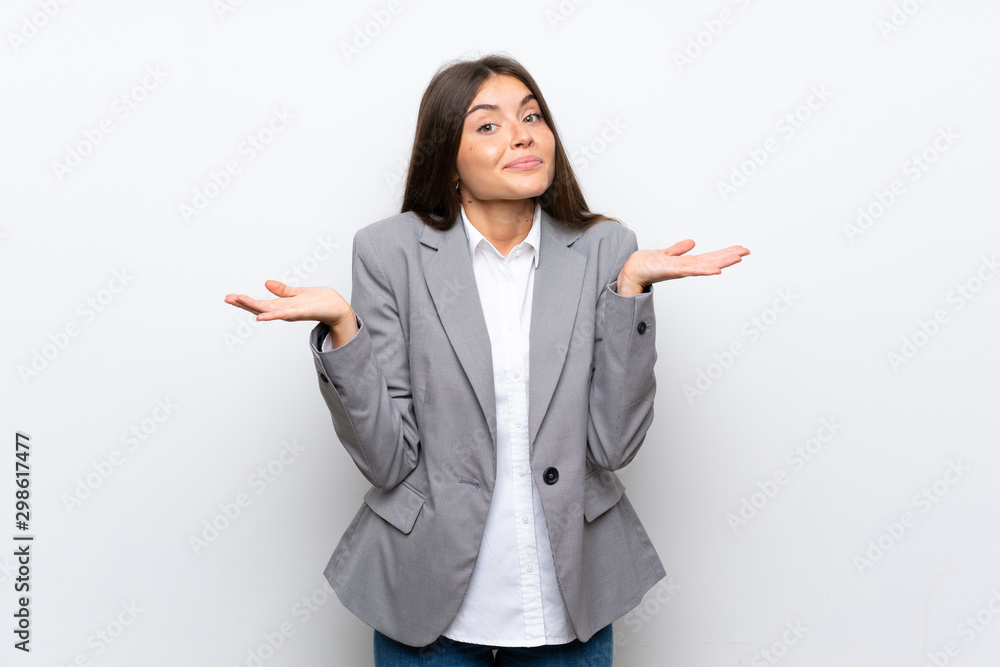 Young business woman over isolated white background making doubts gesture Young business woman over isolated white background making doubts gesture
