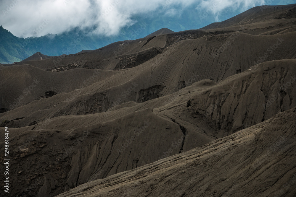 Naklejka premium Black sand dune in Mount Bromo Volcano in East Java Indonesia. Bromo Tengger Semeru National Park, East Java, Indonesia Layer Volcanic ash