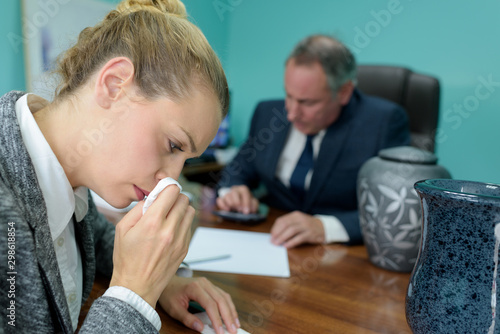 a crying woman before a funeral