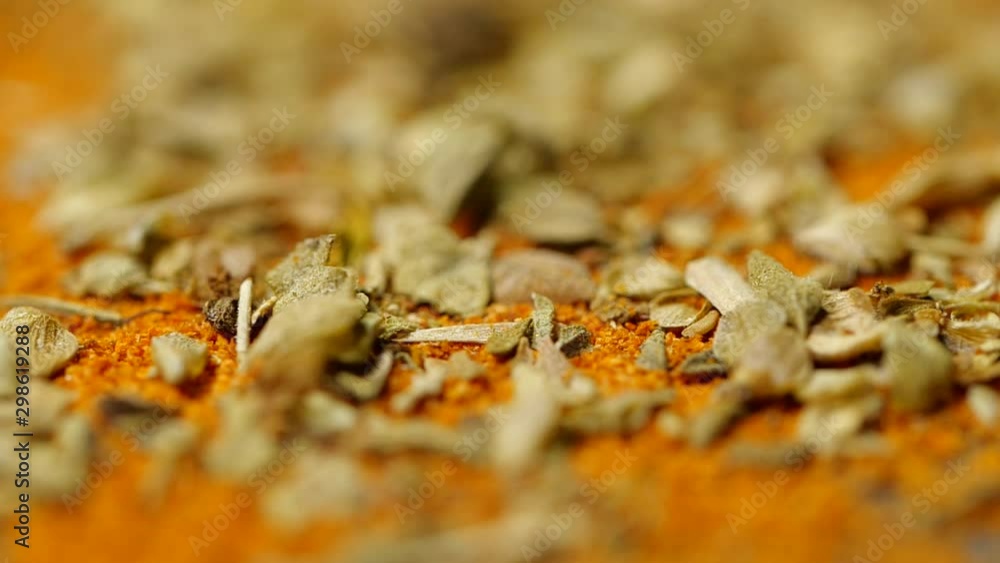 Slow motion of Oregano and Paprika chili powder blow, close-up Slow motion of Oregano and Paprika chili powder blow, close-up