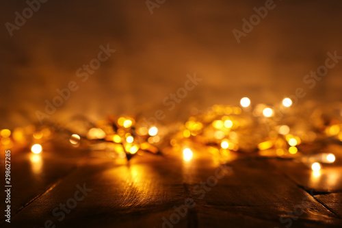 background image of abstract blurred gold garland lights. defocused