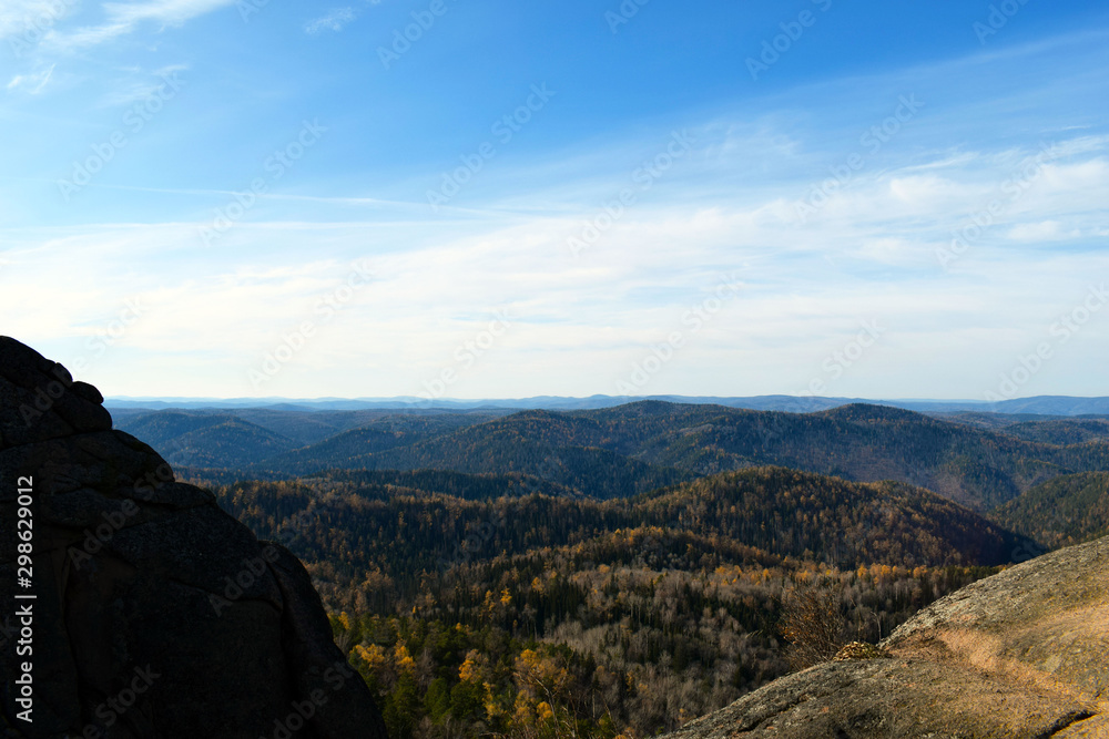 Top view of the mountains and forest. Beautiful nature of Russia. Endless expanses of the taiga.