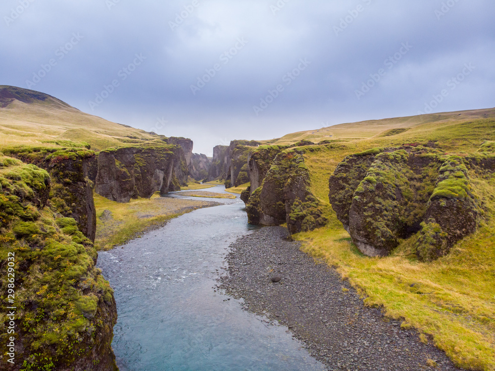 Unique landscape of Fjadrargljufur in Iceland. Top tourism destination. Fjadrargljufur Canyon is a massive canyon about 100 meters deep and about 2 kilometers long, located in South East of Iceland.. Unique landscape of Fjadrargljufur in Iceland. Top tourism destination. Fjadrargljufur Canyon is a massive canyon about 100 meters deep and about 2 kilometers long, located in South East of Iceland..