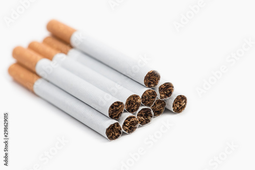 Pile of cigarettes on white background