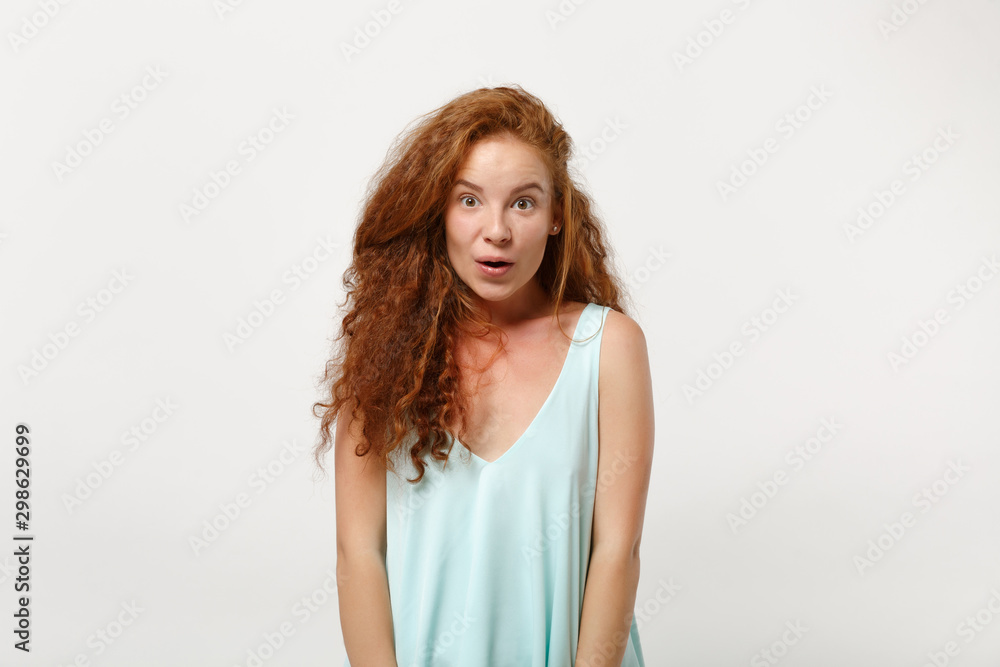 Young amazed shocked redhead woman girl in casual light clothes posing isolated on white background, studio portrait. People sincere emotions lifestyle concept. Mock up copy space. Keeping mouth open. Young amazed shocked redhead woman girl in casual light clothes posing isolated on white background, studio portrait. People sincere emotions lifestyle concept. Mock up copy space. Keeping mouth open.