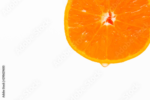 Sliced oranges on the top edge and white background 