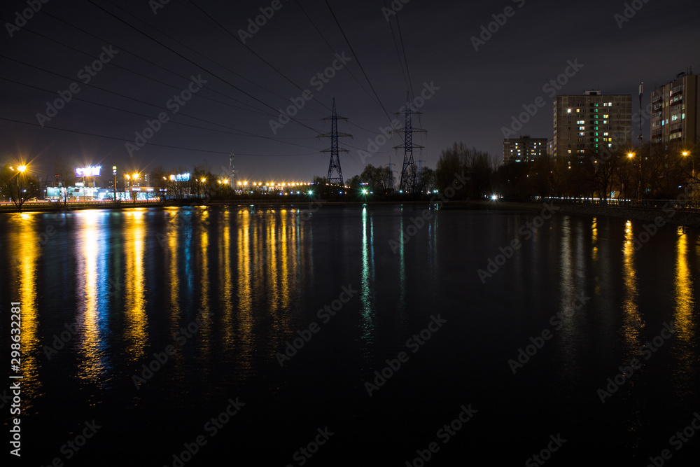 night city with lanterns and reflection in water