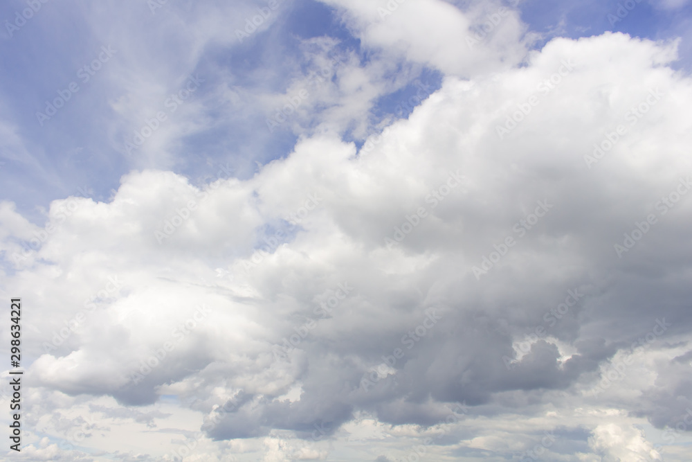 White cumulus clouds in blue sky at daytime. Natural background photo texture White cumulus clouds in blue sky at daytime. Natural background photo texture