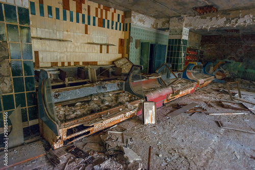 interior of an abandoned grocery store and broken .trading counters in the city of Pripyat in the Chernobyl exclusion zone. Everything was looted after the Chernobyl disaster