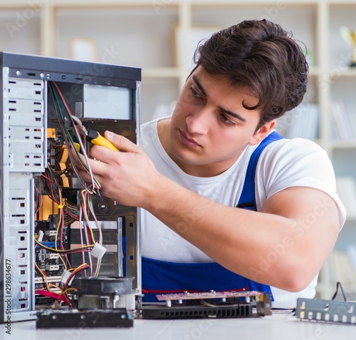 Wallpaper Mural Computer repairman repairing desktop computer Torontodigital.ca