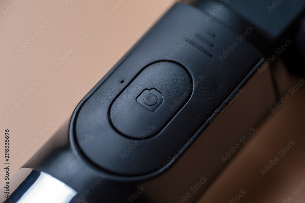 Close-up button on a plastic metal case Close-up button on a plastic metal case