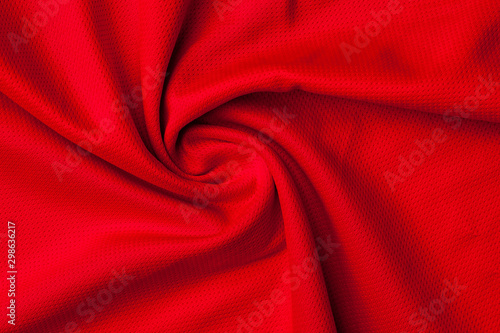 Fragment of crumpled red polyester fabric