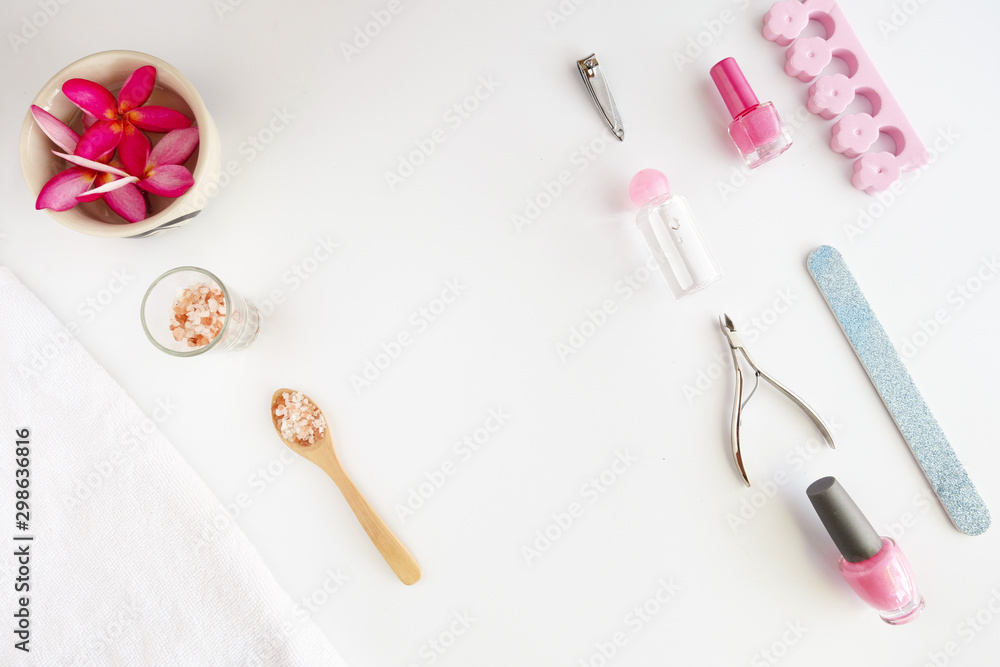 Tools of manicure set for nail care on a white background with a pink color. Beauty concept. Copyspace mockup. Tools of manicure set for nail care on a white background with a pink color. Beauty concept. Copyspace mockup.