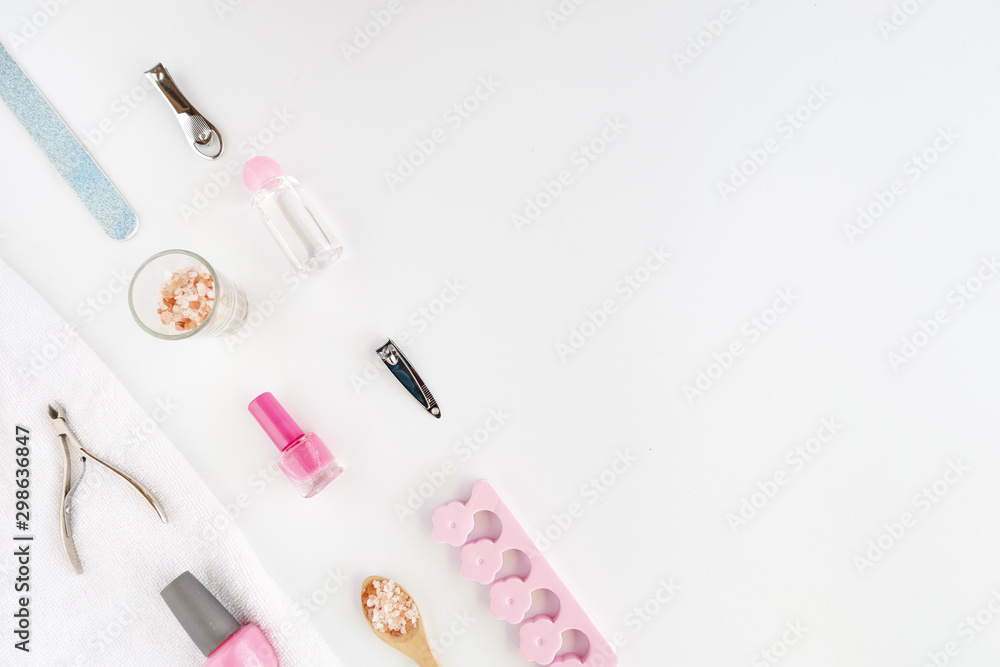 Tools of manicure set for nail care on a white background with a pink color. Beauty concept. Copyspace mockup. Tools of manicure set for nail care on a white background with a pink color. Beauty concept. Copyspace mockup.